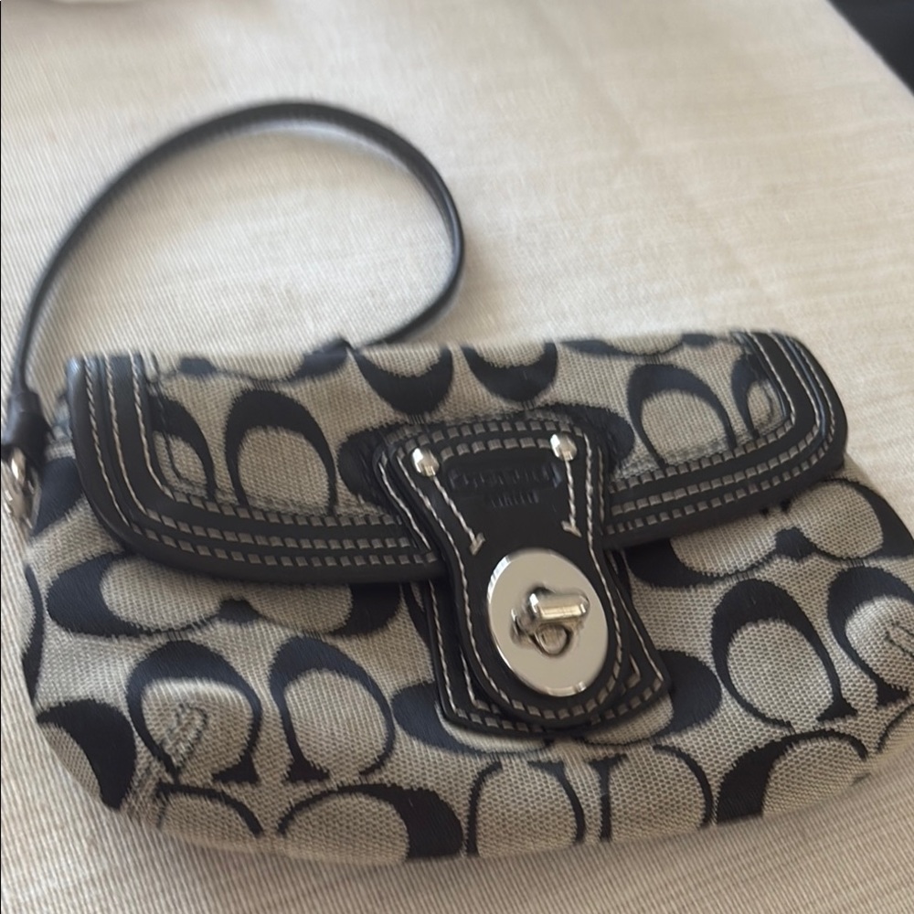 Coach Black and Gray Wristlet with Signature Pattern.